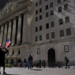 
              A visitor take a photo of the New York Stock Exchange, Friday, Sept. 23, 2022, in New York. Stocks tumbled worldwide Friday on more signs the global economy is weakening, just as central banks raise the pressure even more with additional interest rate hikes. (AP Photo/Mary Altaffer)
            
