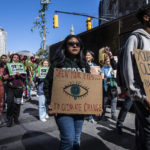 
              Activists gather and walk through lower Manhattan for the Global Climate Strike protests, Friday, Sept. 23, 2022, in New York. (AP Photo/Brittainy Newman)
            