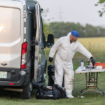 
              An investigator in protective equipment works at a crime scene in Weldon, Saskatchewan, on Sunday, Sept. 4, 2022. Saskatchewan RCMP has confirmed that there are 10 dead while 15 are injured following the stabbings that occurred at James Smith Cree Nation and Weldon in Saskatchewan. (Heywood Yu/The Canadian Press via AP)
            