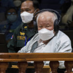 
              In this photo released by the Extraordinary Chambers in the Courts of Cambodia, Khieu Samphan, right, the former head of state for the Khmer Rouge, sits in a courtroom during a hearing at the U.N.-backed war crimes tribunal in Phnom Penh, Cambodia, Thursday, Sept. 22, 2022. The international court convened in Cambodia to judge the brutalities of the Khmer Rouge regime that caused the deaths of an estimated 1.7 million people in the 1970s ends its work Thursday after spending $337 million and 16 years to convict just three men of crimes. (Nhet Sok Heng/Extraordinary Chambers in the Courts of Cambodia via AP)
            
