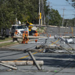
              Workers assess downed power poles caused by post-tropical storm Fiona in Dartmouth, Nova Scotia, Sunday, Sept. 25, 2022. Hundreds of thousands of people in Atlantic Canada remain without power and officials are trying to assess the scope of devastation from former Hurricane Fiona. It swept away houses, stripped off roofs and blocked roads across the country’s Atlantic provinces. (Darren Calabrese/The Canadian Press via AP)
            