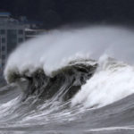 
              High waves crash onto a beach in Busan, South Korea, as Typhoon Hinnamnor approaches the Korean Peninsula on Monday, Sept. 5, 2022. Hundreds of flights were grounded and more than 200 people evacuated in South Korea on Monday as Typhoon Hinnamnor approached the southern region with heavy rains and winds of up to 170 kilometers (105 miles) per hour, putting the nation on alert for its worst storm in decades. (Son Hyung-joo/Yonhap via AP)
            