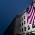 
              A U.S. flag is unfurled at the Pentagon in Washington, Sunday, Sept. 11, 2022, at sunrise on the morning of the 21st anniversary of the 9/11 terrorist attacks. (AP Photo/Andrew Harnik)
            