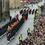 
              A procession leaves after a public Proclamation to the people of Scotland to announce the Accession of King Charles III, outside St Giles Cathedral, on the Royal Mile, in Edinburgh, Scotland, Sunday, Sept. 11, 2022. Queen Elizabeth II, Britain's longest-reigning monarch, died Thursday Sept. 8, 2022, after 70 years on the throne. (AP Photo/Petr David Josek)
            
