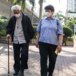 
              Cardinal Joseph Zen, left, arrives at the West Kowloon Magistrates' courts in Hong Kong on Monday, Sept. 26, 2022. The 90-year-old Catholic cardinal and five others stood trial in Hong Kong on Monday for allegedly failing to register a now-defunct fund set up to assist people arrested in the mass anti-government protests in the city three years ago. (AP Photo/Oiyan Chan)
            