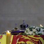 
              CORRECTS DATE TO SEPT. 17  The coffin of Britain's Queen Elizabeth, draped in the Royal Standard with the Imperial State Crown and the Sovereign's orb and sceptre, is pictured on the catafalque inside Westminster Hall, following her death, in London, Saturday, Sept. 17, 2022. (Marko Djurica/Pool via AP)
            
