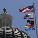
              The rainbow Pride flag flutters from the flag pole at the state Capitol in Sacramento, Calif., Monday, June 17, 2019. California's governor has signed a law he says will help military service members who were discharged under "don't ask, don't tell" policies to reestablish eligibility for Veterans Affairs benefits. Gov. Gavin Newsom said Saturday, Sept. 17, 2022, many veterans who were discharged because of sexual or gender identities don't know how to access benefits they might be eligible for. The law requires the state to create a grant program to help LGBTQ veterans through the process. (AP Photo/Rich Pedroncelli, File)
            