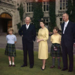 
              FILE - Britain's Queen Elizabeth II stands on the grounds of Balmoral Castle, in Royal Deeside, Scotland, with U.S. President Dwight D. Eisenhower, Aug. 29, 1959. From left to right are: Prince Philip, partially hidden, Princess Anne, Eisenhower, Queen Elizabeth II and Prince Charles. The two men on the right are unidentified. (AP Photo, File)
            