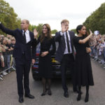 
              From left, Britain's Prince William, Prince of Wales, Kate, Princess of Wales, Prince Harry and Meghan, Duchess of Sussex wave to members of the public at Windsor Castle, following the death of Queen Elizabeth II on Thursday, in Windsor, England, Saturday, Sept. 10, 2022. (Kirsty O'Connor/Pool Photo via AP)
            