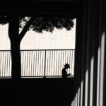 
              FILE - A man is silhouetted against a wall as he looks down at his cellphone outside the Clara Shortridge Foltz Criminal Justice Center, Thursday, July 29, 2021, in Los Angeles. Civil rights lawyers and Democratic senators are pushing for legislation that would limit U.S. law enforcement agencies’ ability to buy cellphone tracking tools to follow people’s whereabouts, including back years in time, and sometimes without a search warrant. (AP Photo/Chris Pizzello, File)
            