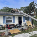 
              In this photo provided by Cheynne Prevatt, Prevatt's home, seen Thursday, Sept. 29, 2022, was damaged by Hurricane Ian and by a fallen palm tree, making it uninhabitable, in Englewood, Fla. (Cheynne Prevatt via AP)
            