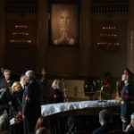 
              People walk past the coffin of former Soviet President Mikhail Gorbachev inside the Pillar Hall of the House of the Unions during a farewell ceremony in Moscow, Russia, Saturday, Sept. 3, 2022. Gorbachev, who died Tuesday at the age of 91, will be buried at Moscow's Novodevichy cemetery next to his wife, Raisa, following a farewell ceremony at the Pillar Hall of the House of the Unions, an iconic mansion near the Kremlin that has served as the venue for state funerals since Soviet times. (AP Photo/Alexander Zemlianichenko)
            