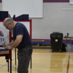 
              A voter fills out his ballot, Tuesday, Sept. 6, 2022, in the Massachusetts' primary election at a polling place, in Wrentham, Mass. (AP Photo/Steven Senne)
            