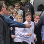 
              In this image taken from video, school children run from the scene of a shooting at school No. 88 in Izhevsk, Russia, Monday, Sept. 26, 2022. Authorities say a gunman has killed 15 people and wounded 24 others in the school in central Russia. According to officials, 11 children were among those killed in the Monday morning shooting. (Izhlife.ru via AP)
            