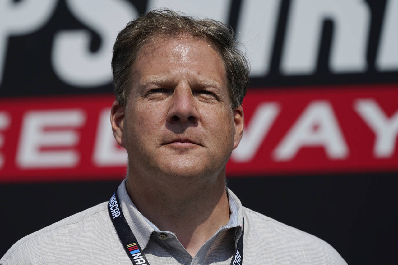 FILE - New Hampshire Gov. Chris Sununu arrives for the NASCAR Cup Series auto race at the New Hamps...