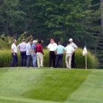 
              Former President Donald Trump, center, stands on his golf course with others at Trump National Golf Club in Sterling, Va., Monday, Sept. 12, 2022. (AP Photo/Alex Brandon)
            