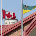 
              The flag of Canada and the flag of Saskatchewan are at half-mast to show respect to the victims of the stabbing rampage that happened at James Smith Cree Nation and Welton at the City Hall of Melfort, in Saskatchewan, on Wednesday, Sept. 7, 2022. (Heywood Yu/The Canadian Press via AP)
            