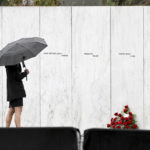 
              A visitor looks at the Wall of Names before a ceremony commemorating the 21st anniversary of the Sept. 11, 2001 terrorist attacks at the Flight 93 National Memorial in Shanksville, Pa., Sunday, Sept. 11, 2022. (AP Photo/Barry Reeger)
            