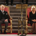 
              King Charles III and Camilla, the Queen Consort sit, in Westminster Hall, where both Houses of Parliament met to express their condolences, following the death of Queen Elizabeth II, in London, Monday, Sept. 12, 2022. Queen Elizabeth II, Britain's longest-reigning monarch and a rock of stability across much of a turbulent century, died Thursday Sept. 8, 2022, after 70 years on the throne. She was 96. (Dan Kitwood/Pool Photo via AP)
            