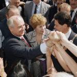 
              FILE -- Bonn citizens reach out their hands to welcome then Soviet President Mikhail Gorbachev and his wife Raisa in Bonn, Germany, Tuesday, June 13, 1989 where about 5,000 people gave a warmly welcome to the Soviet couple. Mikhail Gorbachev was enduringly popular in Germany for enabling the country’s reunification after four decades of post-World War II division — and setting the scene for the peaceful collapse of communism that made it possible.(AP Photo/Fritz Reiss, file)
            