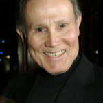 
              FILE - Actor Henry Silva is photographed during fellow actor Ernest Borgnine's 90th birthday party at a restaurant in Los Angeles, on Jan. 24, 2007. Silva, a prolific character actor best known for playing villains and touch guys in “The Manchurian Candidate,” “Ocean's Eleven” and other films, has died at age 95. Silva's son Scott Silva told Variety that he died Wednesday, Sept. 14, 2022, of natural causes at the Motion Picture and Television Country House and Hospital in Woodland Hills, Calif. (AP Photo/Kevork Djansezian, File)
            