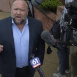 
              Alex Jones speaks with the media outside of Superior Court in Waterbury, Conn., on Thursday, Sept. 22, 2022.  Jones is going to take the stand to testify in a trial in Connecticut over how much in damages he must pay for calling the Sandy Hook school shooting a hoax. (H John Voorhees III /Hearst Connecticut Media via AP)
            