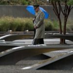 
              Visitors walk through the National 9/11 Pentagon Memorial outside the Pentagon in Washington, Sunday, Sept. 11, 2022, on the morning of the 21st anniversary of the 9/11 terrorist attacks. (AP Photo/Andrew Harnik)
            