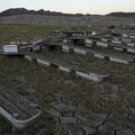 
              Floating boat docks sit on dry ground as water levels have dropped near the Callville Bay Resort & Marina in the Lake Mead National Recreation Area, Tuesday, Aug. 30, 2022, near Boulder City, Nev. The United Nations says weather disasters costing $200 million a day and irreversible climate catastrophe looming show the world is “heading in the wrong direction.” (AP Photo/John Locher)
            