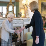
              FILE - Britain's Queen Elizabeth II, left, welcomes Liz Truss during an audience at Balmoral, Scotland, where she invited the newly elected leader of the Conservative party to become Prime Minister and form a new government, Tuesday, Sept. 6, 2022. British Prime Minister Liz Truss took office less than two weeks ago, impatient to set her stamp on government. The death of Queen Elizabeth II ripped up Truss’s carefully laid plans for the first weeks of her term, putting everyday politics in the U.K. on hold as the country was plunged into official and emotional mourning.(Jane Barlow/Pool Photo via AP, File)
            