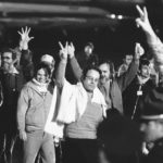 
              FILE - A group of unidentified American hostages give the victory sign as they emerge from an aircraft in Algiers on Jan. 21, 1981 after their flight from Teheran, where they had been held captive for 444 days in Iran. Caulkin, a retired Associated Press photographer has died. He was 77 and suffered from cancer. Known for being in the right place at the right time with the right lens, the London-based Caulkin covered everything from the conflict in Northern Ireland to the Rolling Stones and Britain’s royal family during a career that spanned four decades. (AP Photo/Dave Caulkin, File)
            