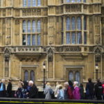 
              People arrive in the queue at Westminster Palace to pay their respect to the late Queen Elizabeth II during the Lying-in State, at Westminster Hall in London, Thursday, Sept. 15, 2022. The Queen will lie in state in Westminster Hall for four full days before her funeral on Monday Sept. 19. (AP Photo/Markus Schreiber)
            