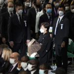 
              Akie Abe, widow of former Prime Minister of Japan Shinzo Abe, arrives with her husband's remains at the state funeral Tuesday Sept. 27, 2022, at Nippon Budokan in Tokyo. (AP Photo/Eugene Hoshiko, Pool)
            