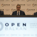 
              Serbian President Aleksandar Vucic, center, speaks during the "Open Balkan" economic forum for regional cooperation in Belgrade, Serbia, Friday, Sept. 2, 2022. (AP Photo/Darko Vojinovic)
            