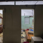 
              Nelson Cirino's home stands with its roof torn off by the winds of Hurricane Fiona in Loiza, Puerto Rico, Sunday, Sept. 18, 2022.(AP Photo/Alejandro Granadillo)
            
