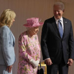 
              FILE - President Joe Biden and first lady Jill Biden smile while standing with Britain's Queen Elizabeth II watching a Guard of Honour march past before their meeting at Windsor Castle near London, June 13, 2021. Queen Elizabeth II, Britain's longest-reigning monarch and a rock of stability across much of a turbulent century, died Thursday, Sept. 8, 2022, after 70 years on the throne. She was 96. (AP Photo/Matt Dunham, Pool, File)
            
