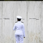
              A sailor with the USS Somerset looks at the Wall of Names before a ceremony commemorating the 21st anniversary of the Sept. 11, 2001 terrorist attacks at the Flight 93 National Memorial in Shanksville, Pa., Sunday, Sept. 11, 2022. (AP Photo/Barry Reeger)
            