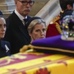 
              Britain's Kate, Princess of Wales, left, and Sophie, Countess of Wessex watch the coffin of Queen Elizabeth arrive in Westminster Hall, London, Wednesday, Sept. 14, 2022. The Queen will lie in state in Westminster Hall for four full days before her funeral on Monday Sept. 19. (AP Photo/Gregorio Borgia, Pool)
            