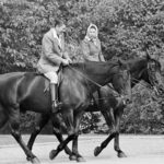 
              FILE - U.S. President Ronald Reagan, on Centennial, and Queen Elizabeth II, on Burmese, go horseback riding in the grounds of Windsor Castle, England, June 8, 1982. Queen Elizabeth II, Britain's longest-reigning monarch and a rock of stability across much of a turbulent century, died Thursday, Sept. 8, 2022, after 70 years on the throne. She was 96. (AP Photo/Bob Daugherty, File)
            