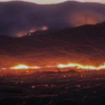 
              Wind whips embers from a hotspot during a wildfire in Castaic, Calif. on Wednesday, Aug. 31, 2022. (AP Photo/Ringo H.W. Chiu)
            