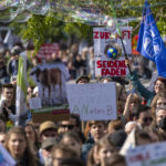 
              Climate activists attend a demonstration in Berlin, Friday, Sept. 23, 2022. Youth activists staged a coordinated “global climate strike” on Friday to highlight their fears about the effects of global warming and demand more aid for poor countries hit by wild weather. (Monika Skolimowska/dpa via AP)
            
