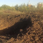 
              In this photo provided by the South Ukraine nuclear power plant, a crater left by a Russian rocket is seen 300 meter from the South Ukraine nuclear power plant, in the background, close to Yuzhnoukrainsk, Mykolayiv region, Ukraine, Monday, Sept. 19, 2022. (South Ukraine Nuclear Power Plant Press Office via AP)
            