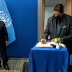 
              Suriname President Chandrikapersad Santokhil signs a guest book as he meets with United Nations Secretary-General Antonio Guterres at U.N. headquarters, Sunday, Sept. 18, 2022. (AP Photo/Craig Ruttle, Pool)
            