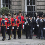 
              Members of the armed services and officials make their way to the Proclamation near St Giles' Cathedral, in Edinburgh, Scotland, Sunday, Sept. 11, 2022. The Queen's coffin will be transported Sunday on a journey from Balmoral to the Palace of Holyroodhouse in Edinburgh, where it will lie at rest before being moved to London later in the week. (AP Photo/Jon Super)
            