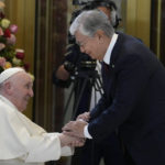 
              Pope Francis, left, meets the Kazakhstan's President Kassym-Jomart Tokayev as he arrives at Our-Sultan's International airport in Nur-Sultan, Kazakhstan, Tuesday, Sept. 13, 2022. Pope Francis begins a 3-days visit to the majority-Muslim former Soviet republic to minister to its tiny Catholic community and participate in a Kazakh-sponsored conference of world religious leaders. (AP Photo/Andrew Medichini)
            