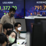 
              Currency traders and an employee watch computer monitors near the screens showing the foreign exchange rate between U.S. dollar and South Korean won, left, and the Korean Securities Dealers Automated Quotations (KOSDAQ) at a foreign exchange dealing room in Seoul, South Korea, Tuesday, Sept. 13, 2022. Asian stocks followed Wall Street higher on Tuesday ahead of data traders hope will show surging U.S. inflation eased in August, reducing pressure for more interest rate hikes. (AP Photo/Ahn Young-joon)
            