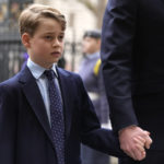 
              FILE - Britain's Prince George holds the hand of his father Prince William as they arrive to attend a Service of Thanksgiving for the life of Prince Philip, Duke of Edinburgh at Westminster Abbey in London, Tuesday, March 29, 2022. (AP Photo/Matt Dunham, File)
            