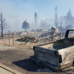 
              A neighborhood smolders after being destroyed by the Mill Fire in Weed, Calif. Friday, Sept. 2, 2022. (Hung T. Vu/The Record Searchlight via AP)
            