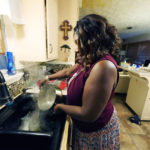 
              Bennie Hudson, 65, executive director of the Mississippi Faith-Based Coalition for Community Renewal, pours boiling water into her sink before washing dishes at her Jackson, Miss., home Thursday, Sept. 1, 2022. Hudson boils any tap water she uses due to the city's longstanding water problems. (AP Photo/Rogelio V. Solis)
            