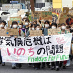 
              Climate activists attend a demonstration in Tokyo, Friday, Sept. 23, 2022. Youth activists staged a coordinated “global climate strike” on Friday to highlight their fears about the effects of global warming and demand more aid for poor countries hit by wild weather. The banner, front, reads "Climate crisis is a life issue." (Kyodo News via AP)
            