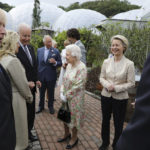 
              FILE - Britain's Queen Elizabeth II speaks to U.S. President Joe Biden and his wife Jill Biden during a reception with the G7 leaders at the Eden Project in Cornwall, England, June 11, 2021, during the G7 summit. Queen Elizabeth II, Britain's longest-reigning monarch and a rock of stability across much of a turbulent century, died Thursday, Sept. 8, 2022, after 70 years on the throne. She was 96. (Jack Hill/Pool via AP, File)
            